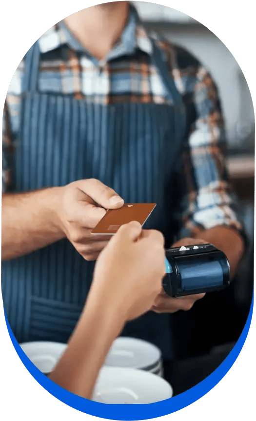 Man taking payment, discussing the benefits of payment processing