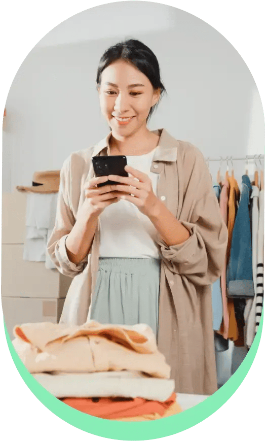Woman using a hosted payment page on her mobile phone