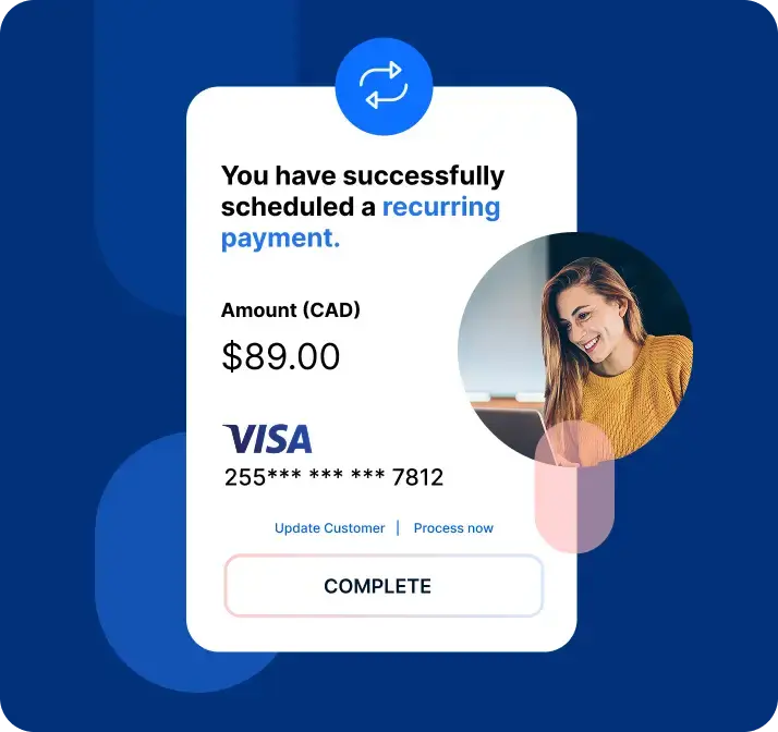 Woman smiling after setting up recurring payments on laptop