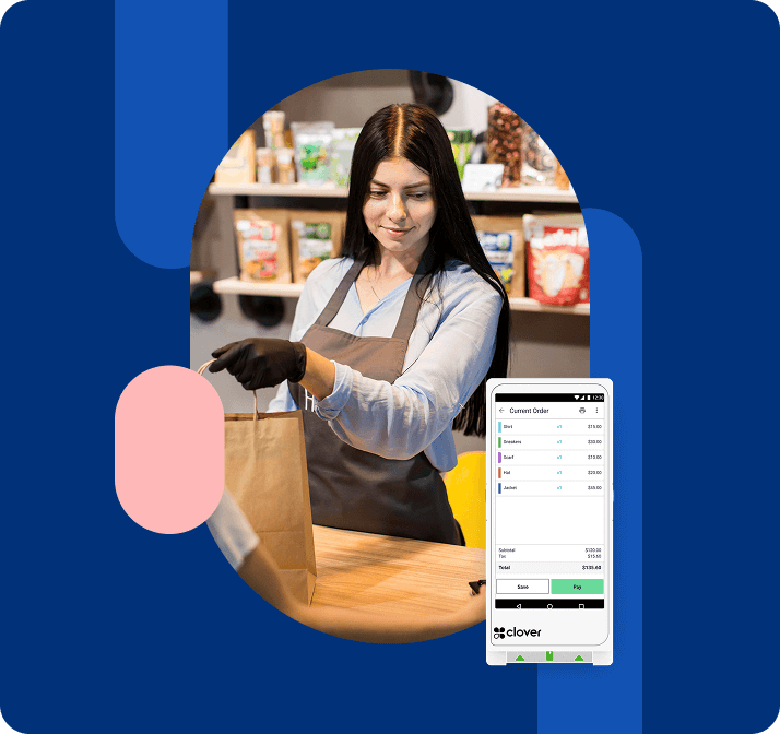 Retail owner handing a bag to a customer while checking the Clover POS machine screen