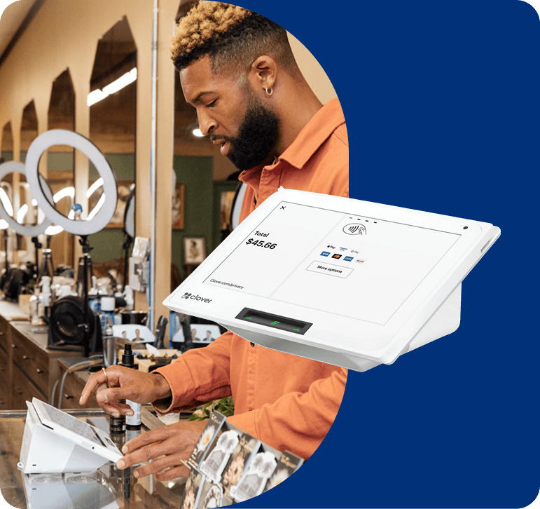 Salon owner using a POS system to accept customer payment
