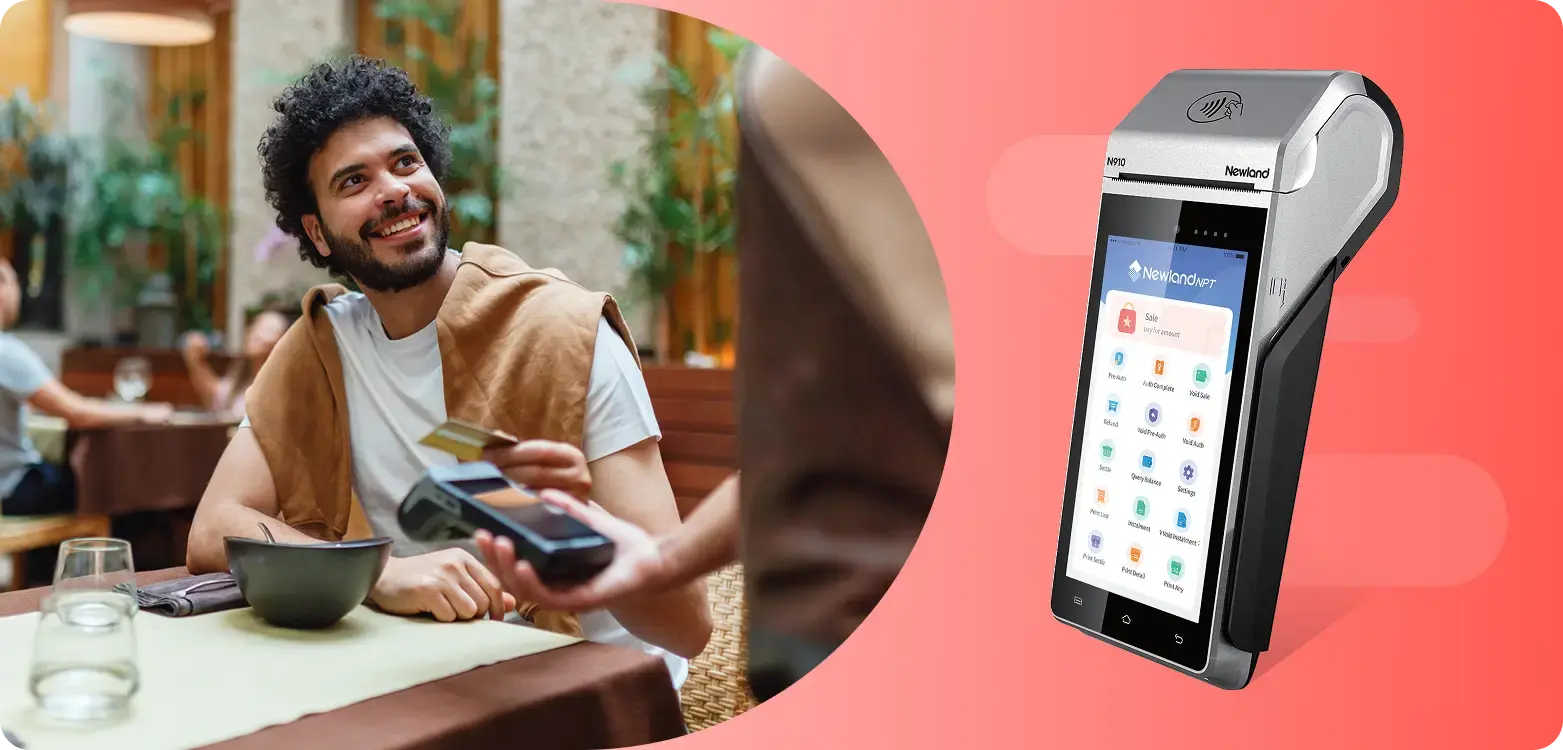 Man paying for his meal at a restaurant on a payment terminal