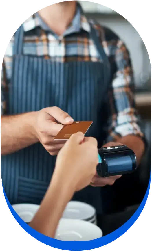 Man taking payment, discussing the benefits of payment processing