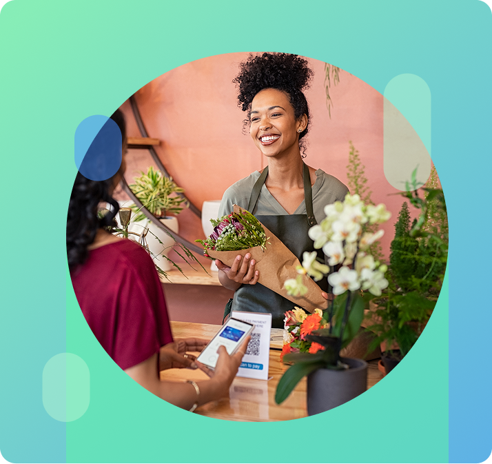 Florist accepting payment from customer through QR code