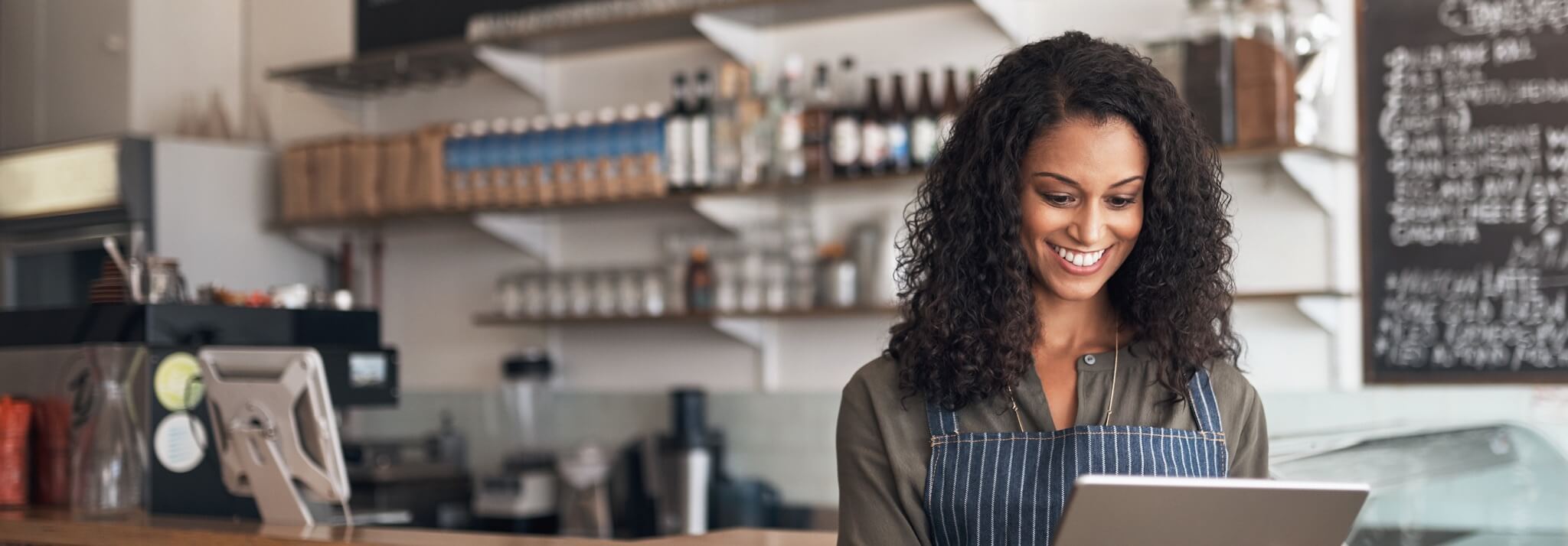 Employee in restaurant using virtual terminal